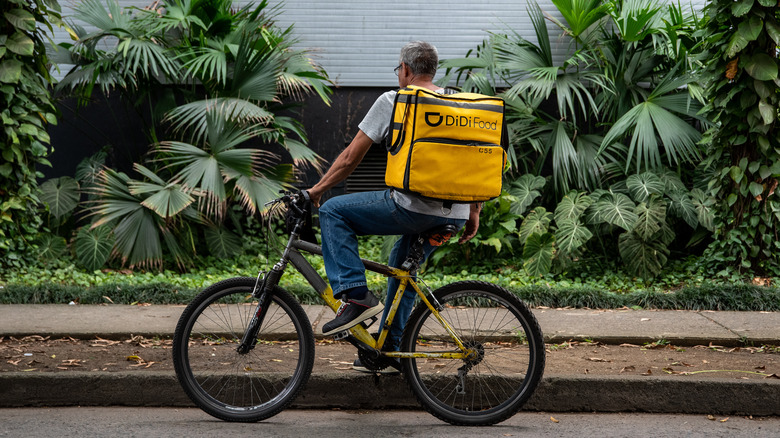 Food delivery worker on bike