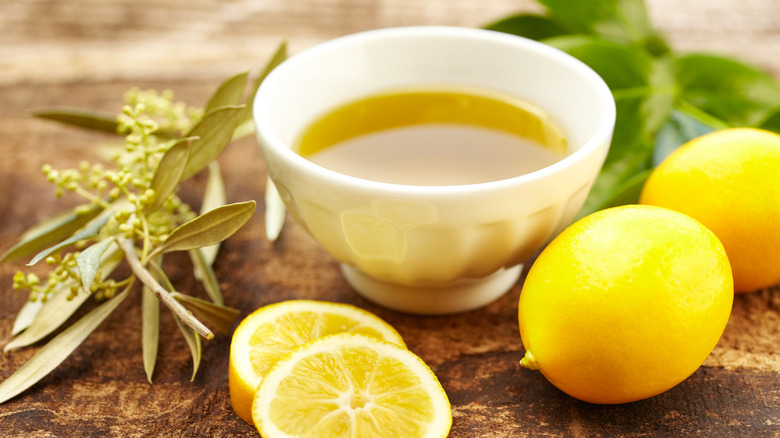 Bowl of olive oil with lemons