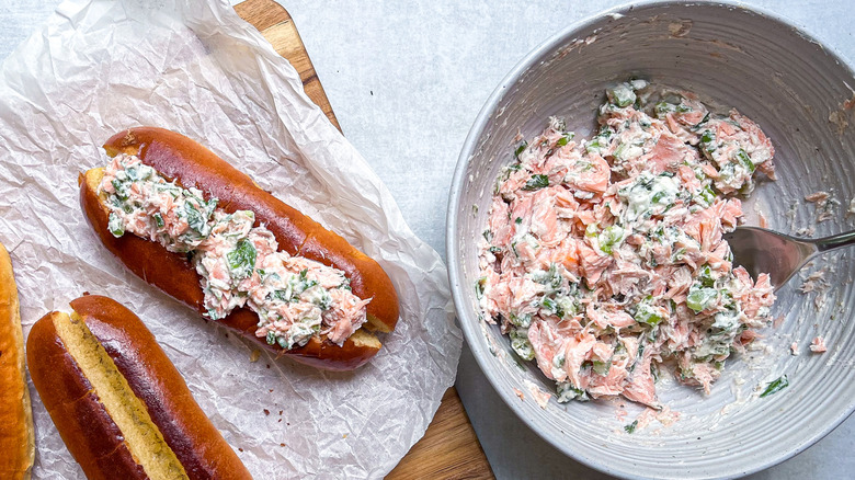 Salmon salad in a bowl and on buns