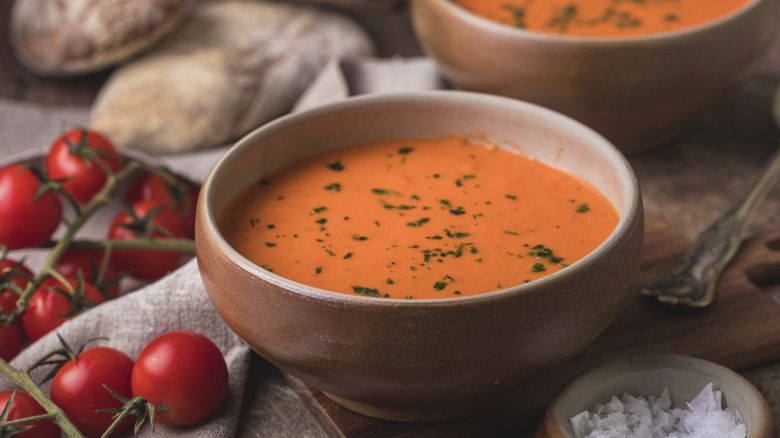 bowl of tomato soup with salt