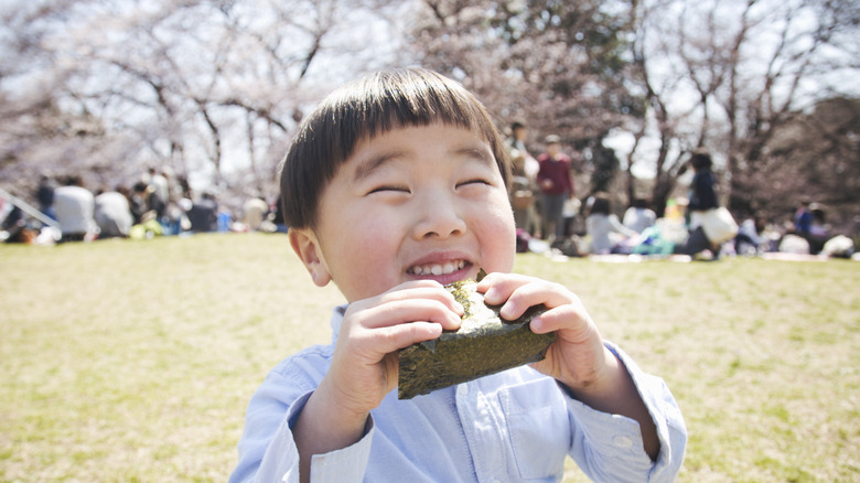 child enjoying onigiri