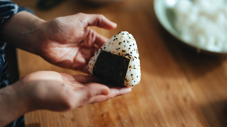 onigiri held in hands