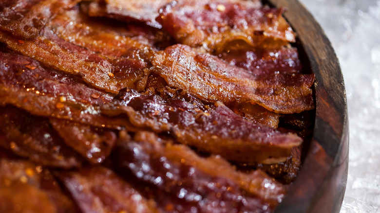 candied bacon in a wood bowl