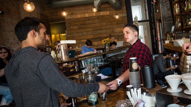 Customer buying coffee