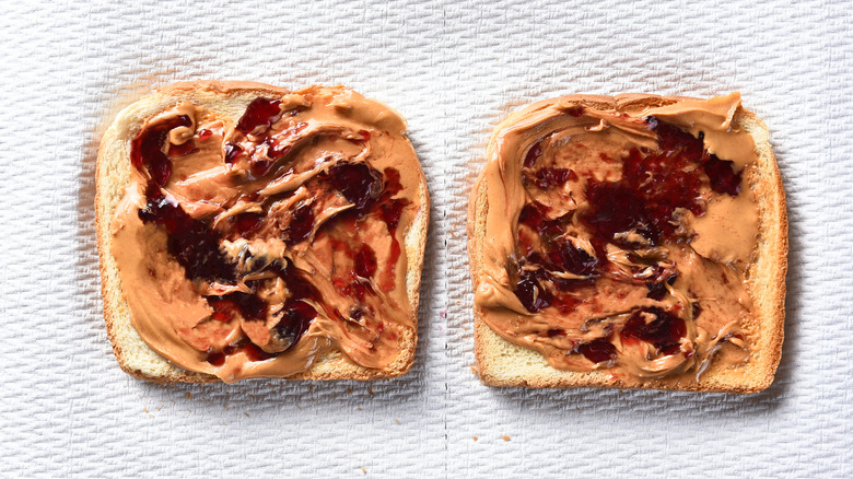 two slices of bread with peanut butter the jelly