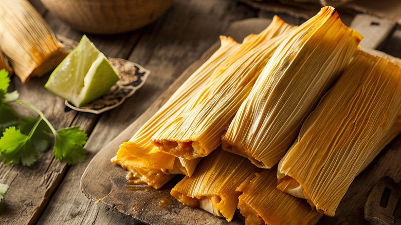 A stack of tamales on wooden table