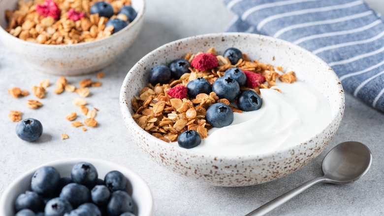 Yogurt in a bowl with fruit and granola