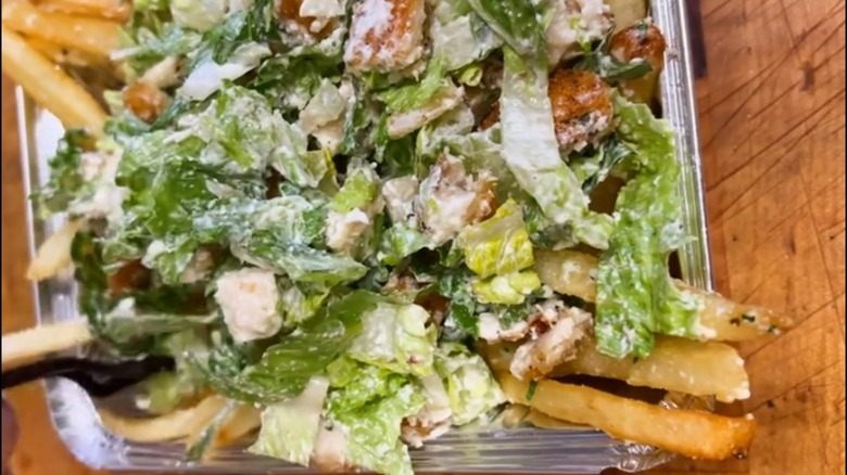 chicken Caesar salad on fries