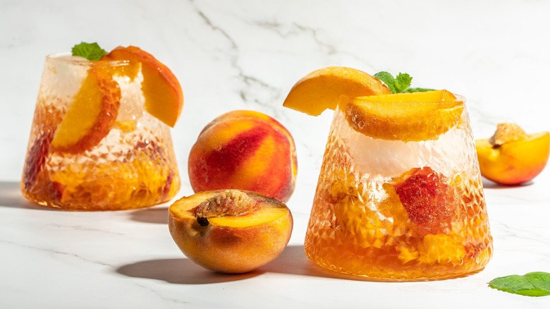 Two bourbon and peach cocktails