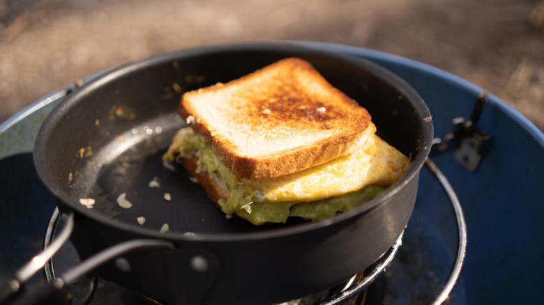 egg sandwich toasting in a sauce pan