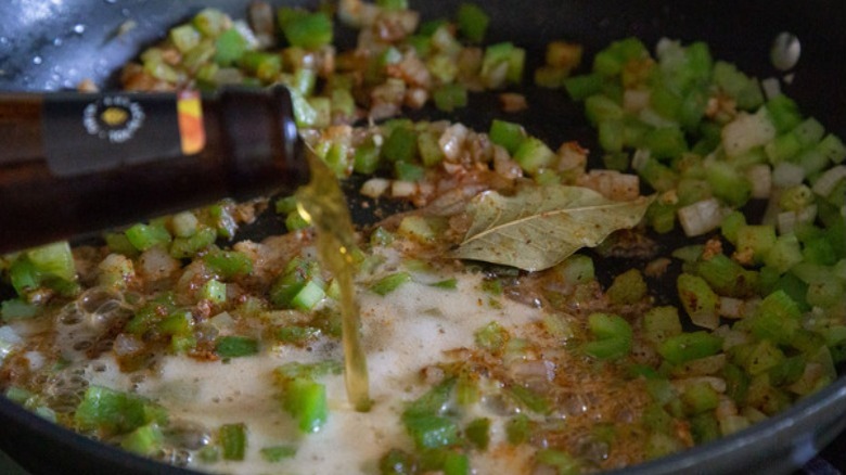 Beer being put into dirty rice