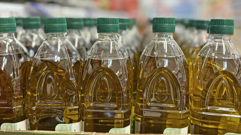 Rows of plastic olive oil bottles