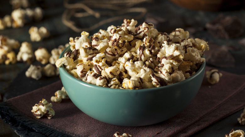 bowl of popcorn drizzled with chocolate