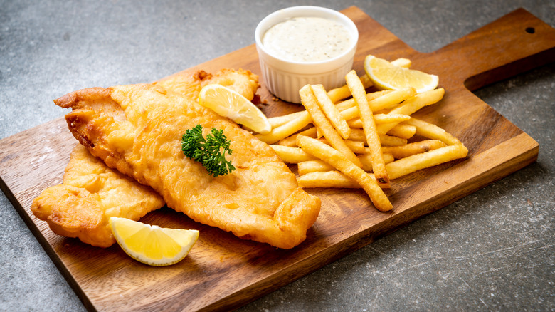 Fish and chips on serving board