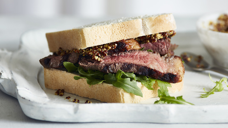 Steak sandwich on serving platter