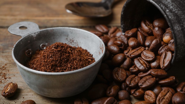 bowl of ground coffee and whole beans