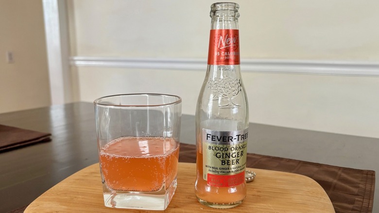 A bottle of Fever-Tree Blood Orange Ginger Beer with a glass