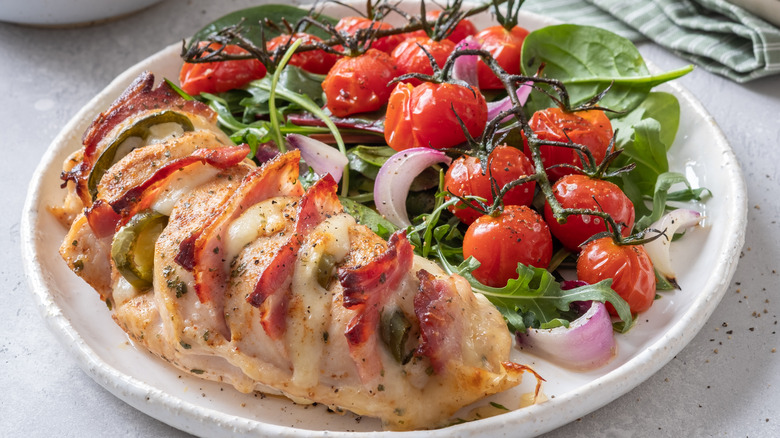 Hasselback chicken breast with salad