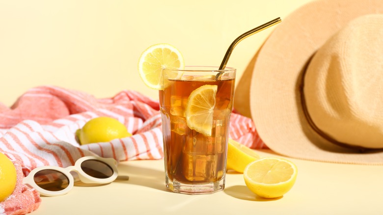 glass of Hawaiian iced tea with beach background