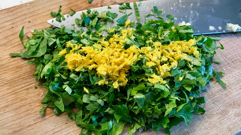 Chopped gremolata on cutting board