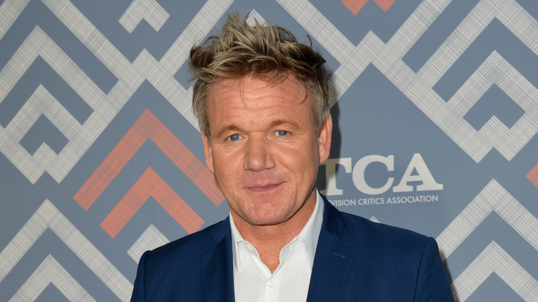 Celebrity chef Gordon Ramsay in blue suit and white shirt