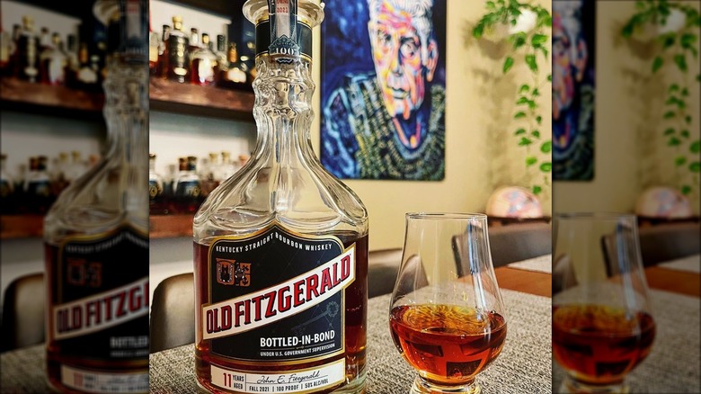 Old Fitzgerald bourbon with a painting of Bourdain in the background