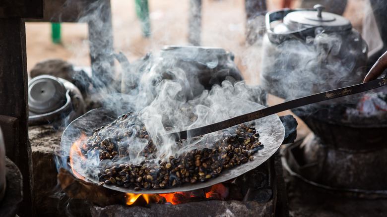 Traditional coffee roasting in pan 