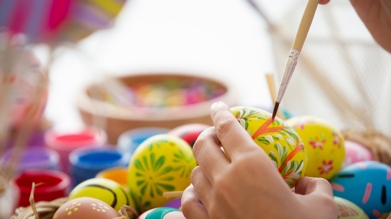 Person painting Easter eggs
