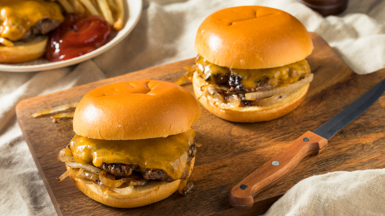 onion burgers fries cutting board