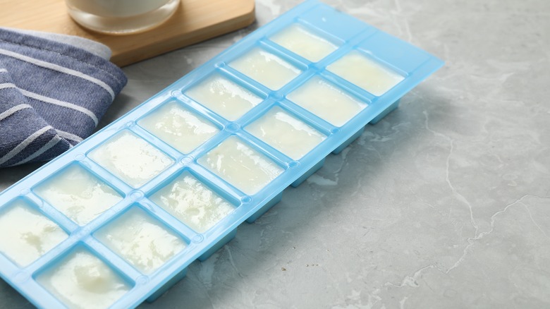 Ice cube tray with frozen milk