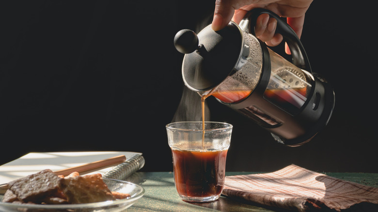 coffee being poured from a french press