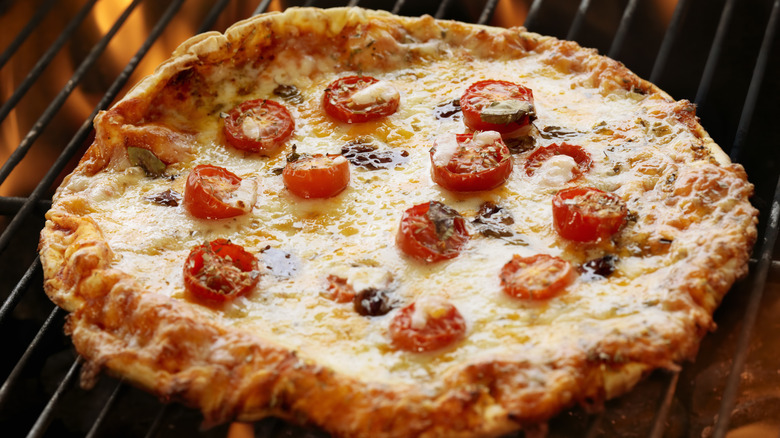 pizza being reheated on a grill