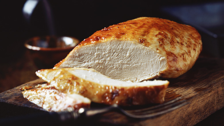 Sliced turkey on a wooden platter