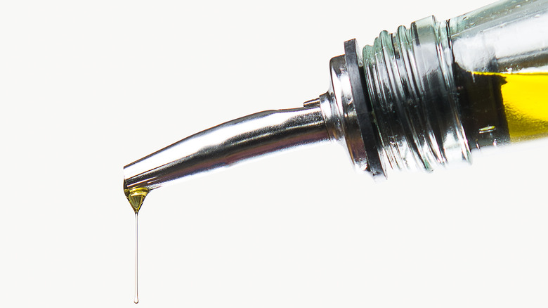 oil dripping from metal dispenser tip
