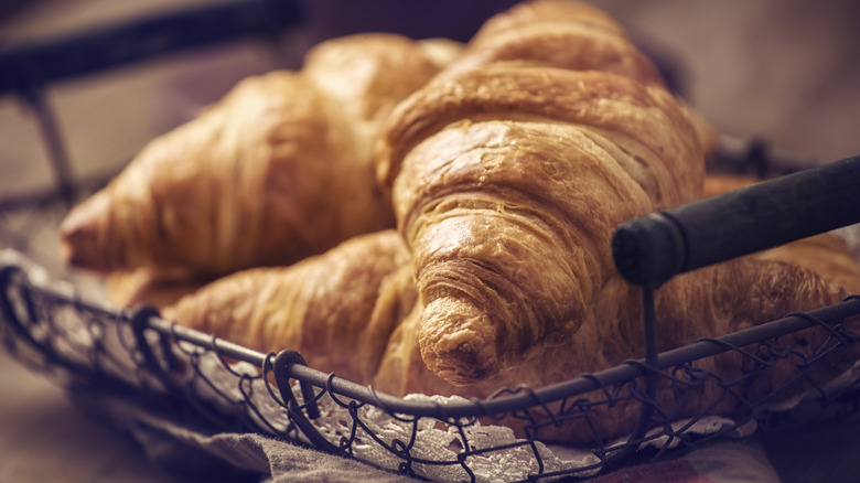 Viennoiserie croissants in wire basket