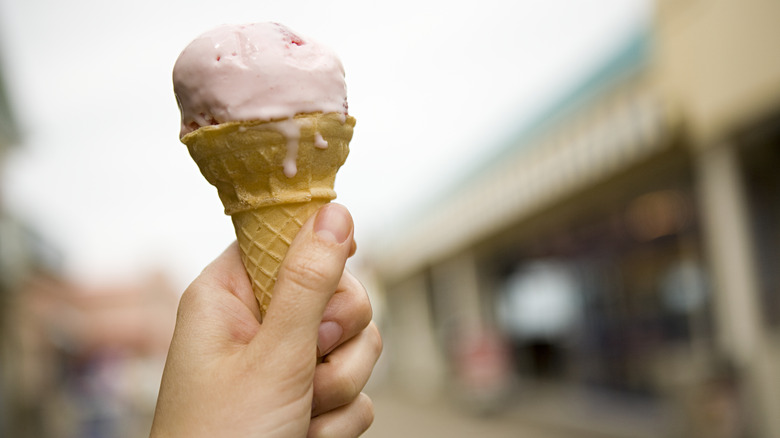 Hand holding ice cream cone