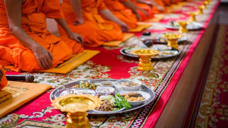 Buddhist monks enjoying lunch