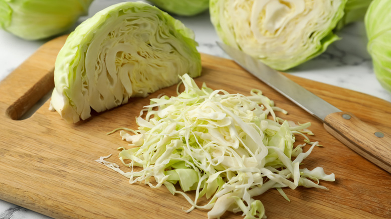 shredded cabbage on cutting board