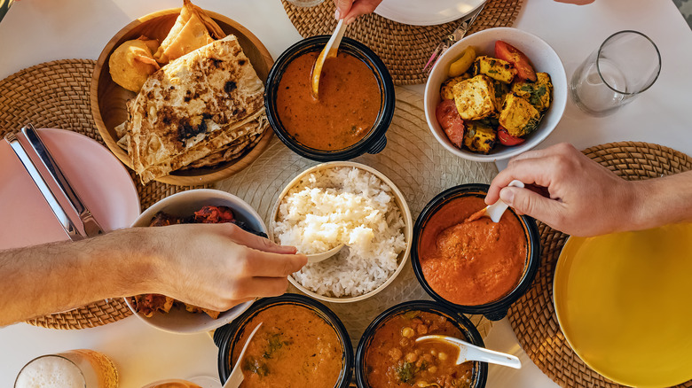 naan alongside a lavish spread of food