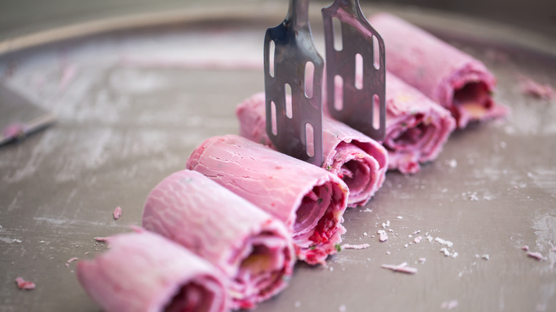 spatula grabbing rolled ice cream