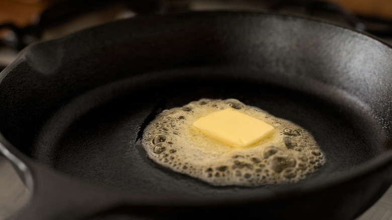 Butter melting in a cast iron friend