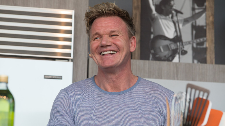 Gordon Ramsay smiles in a kitchen