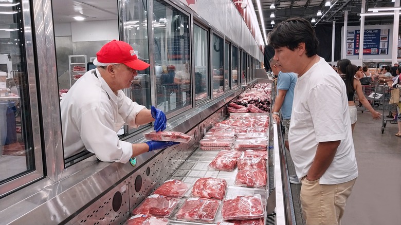 costco butcher speaks to customer