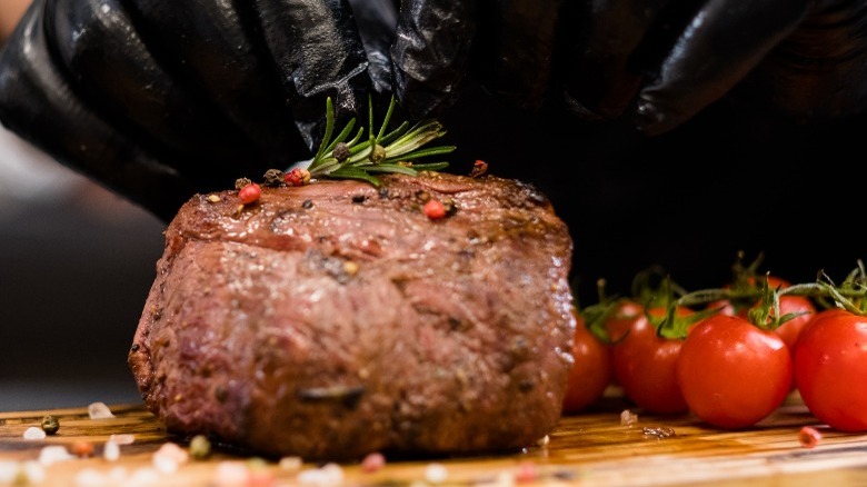 baseball steak with red peppercorns and rosemary