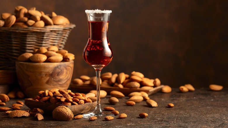 A glass of Amaretto with almonds