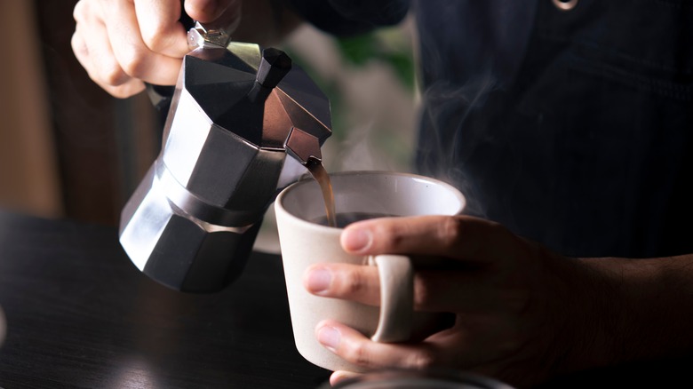 pouring coffee into mug