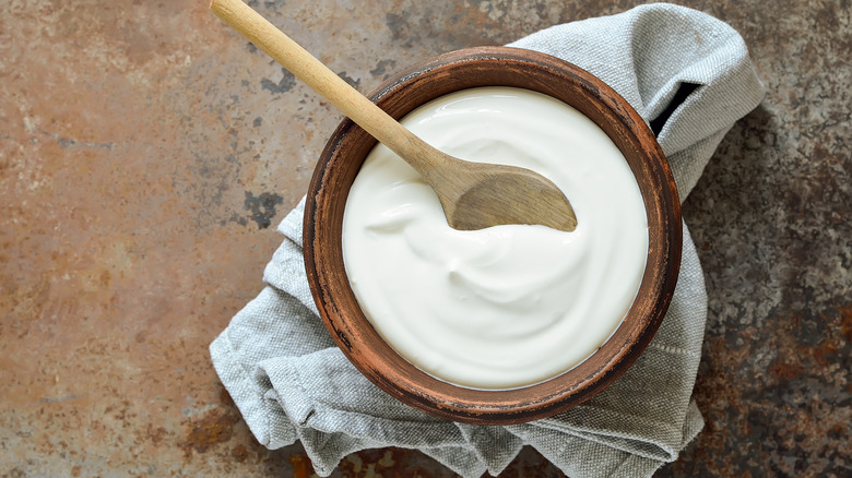 Yogurt in bowl with spoon
