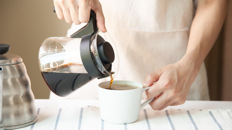 pouring coffee into a mug