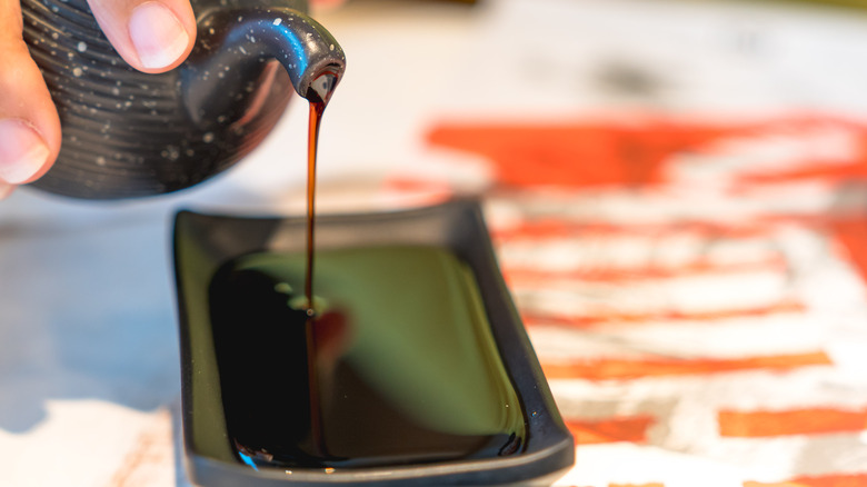 fish sauce pouring into dish