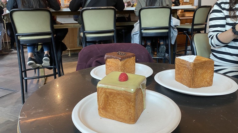 three luxurious le cubes on a table